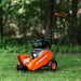 An orange and black SuperHandy stump grinder with a 9HP engine and a 12-inch cutting blade. Front side view outdoors.