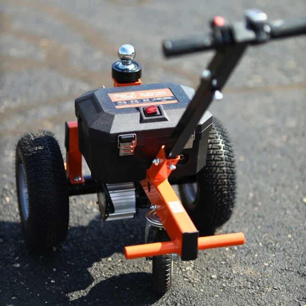 Small superhandy 2800 lbs power dolly with a motorized unit on an asphalt surface