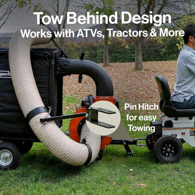 Superhandy towable leaf vacuum with Tow behind design for ATVs and tractors with a person sitting on a trailer.