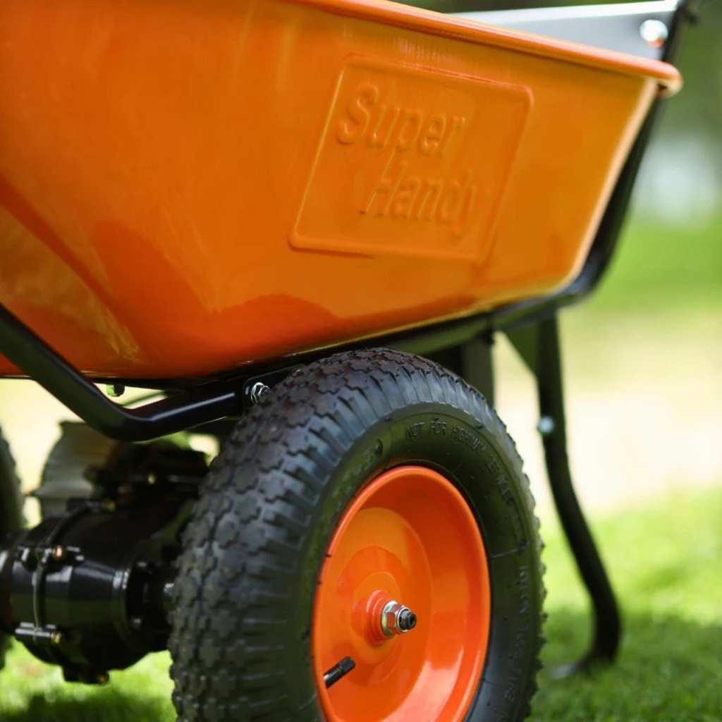 Orange super handy 24v electric wheelbarrow with 'Super Handy' branding on a grassy background