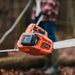 Orange superhandy electric winch being used in a forest setting