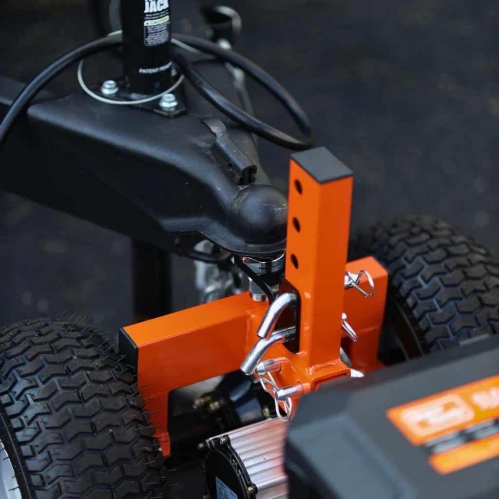 Close-up of a superhandy 3600 lb electric trailer dolly with an orange attachment on a blurred background