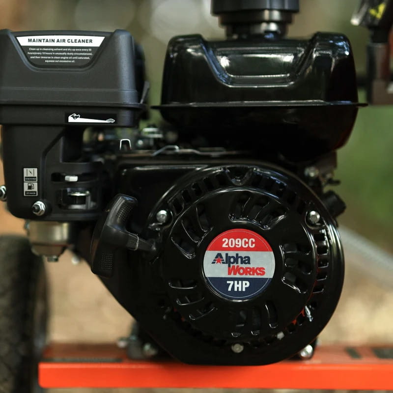 Close-up of a black engine of a superhandy 20 ton gas powered log splitter with 'Alpha Works' label on a blurred background