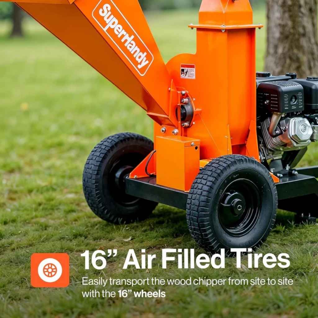 Orange superhandy 4 inch tow behind wood chipper with 16-inch air-filled tires on grass