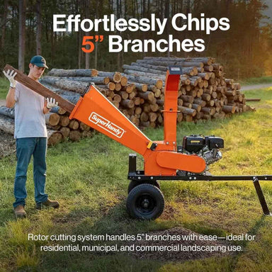 Person using a SuperHandy 5 inch towable wood chipper with text highlighting its branch-chipping capabilities.